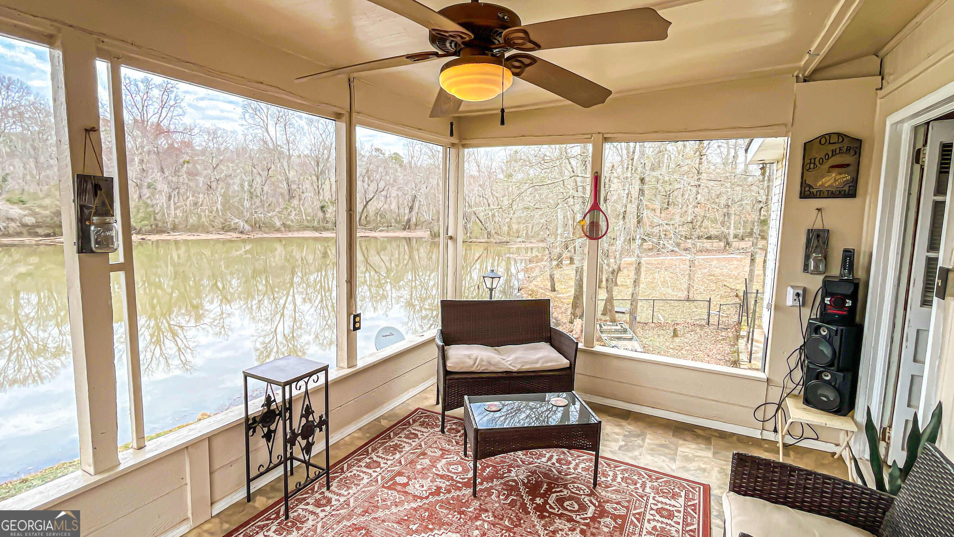 242 Katy Lake Road Jackson, GA 30233 - Photo 70 of 113 a living room with furniture and a floor to ceiling window