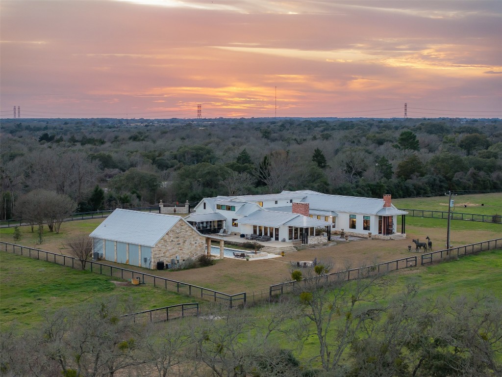 4620 Treybig Loop Fayetteville, TX 78940 - Photo 3 of 24 a view of a big house with a big yard