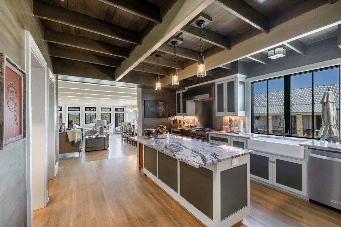 4620 Treybig Loop Fayetteville, TX 78940 - Photo 9 of 24 a view of a kitchen counter space with wooden floor and stainless steel appliances