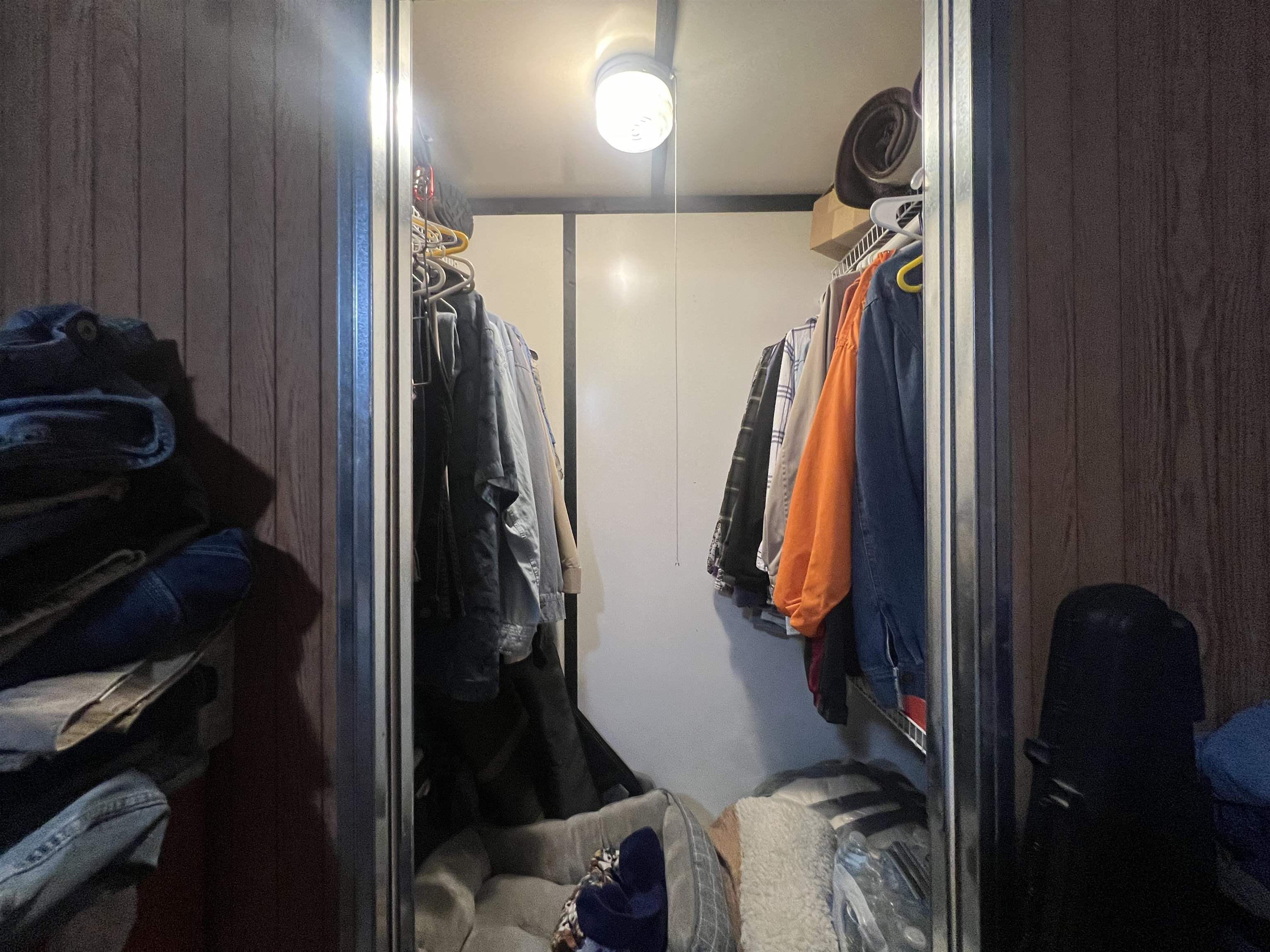 160 Finley Road Adamsville, TN 38310 - Photo 14 of 31 a view of walk in closet with clothes and shoes