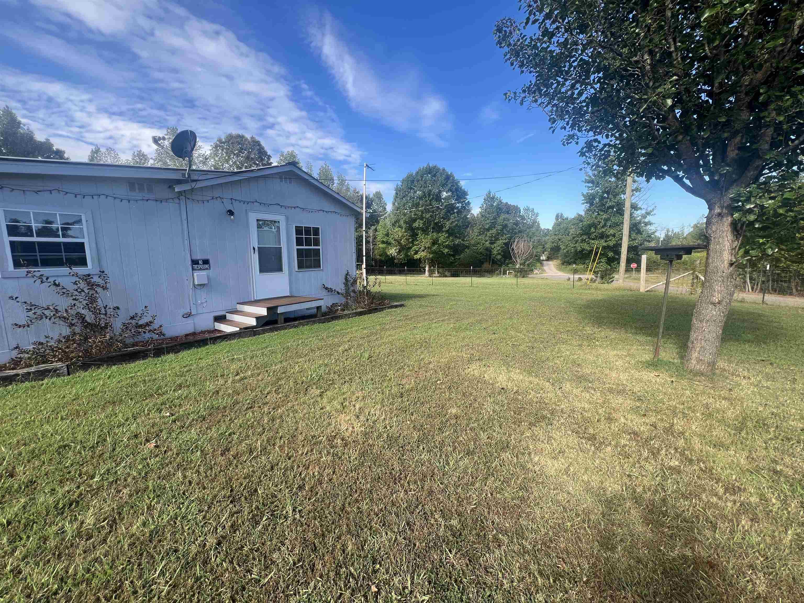 160 Finley Road Adamsville, TN 38310 - Photo 18 of 31 a view of a backyard of the house