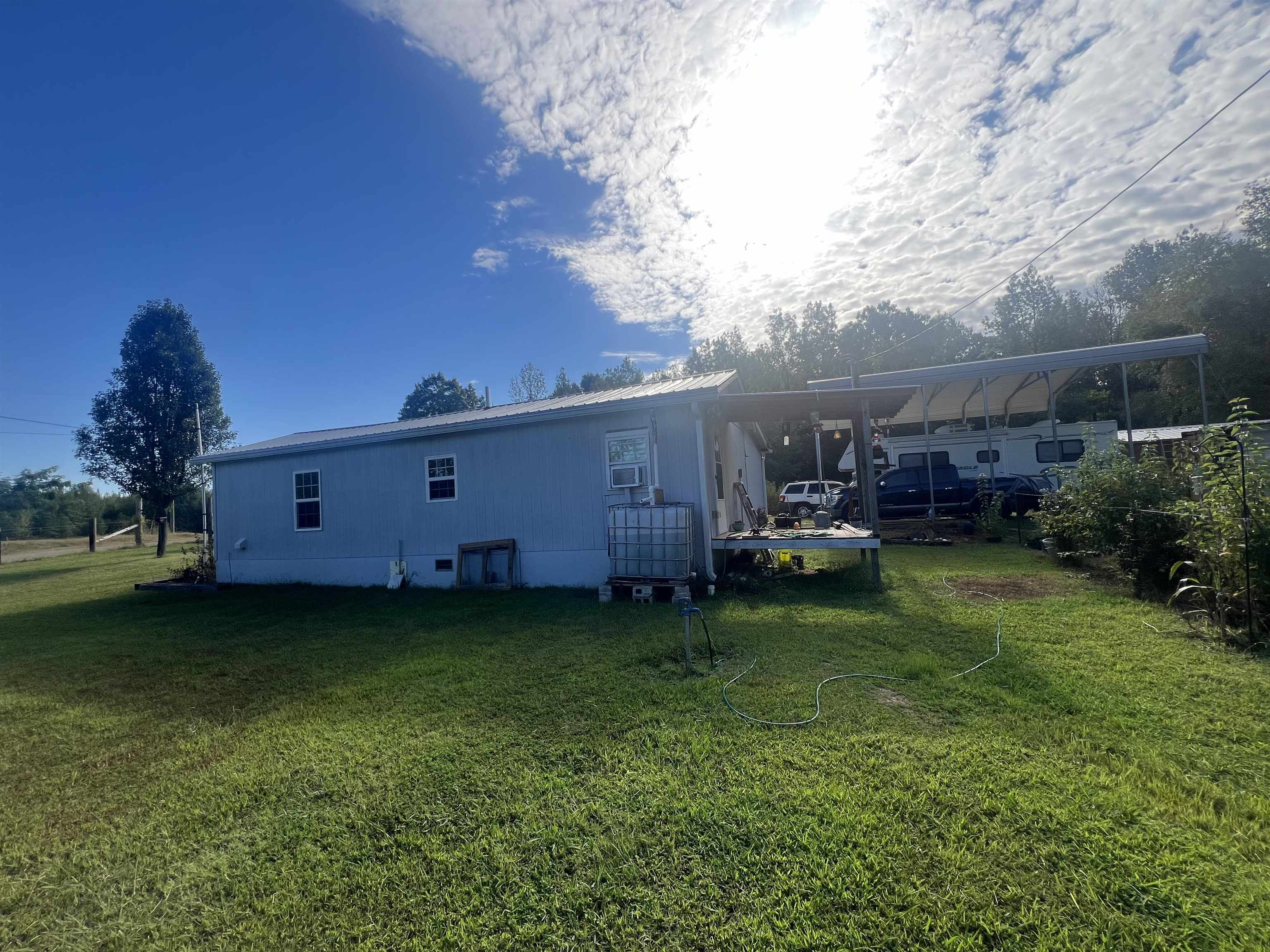 160 Finley Road Adamsville, TN 38310 - Photo 21 of 31 a backyard of a house with lots of green space