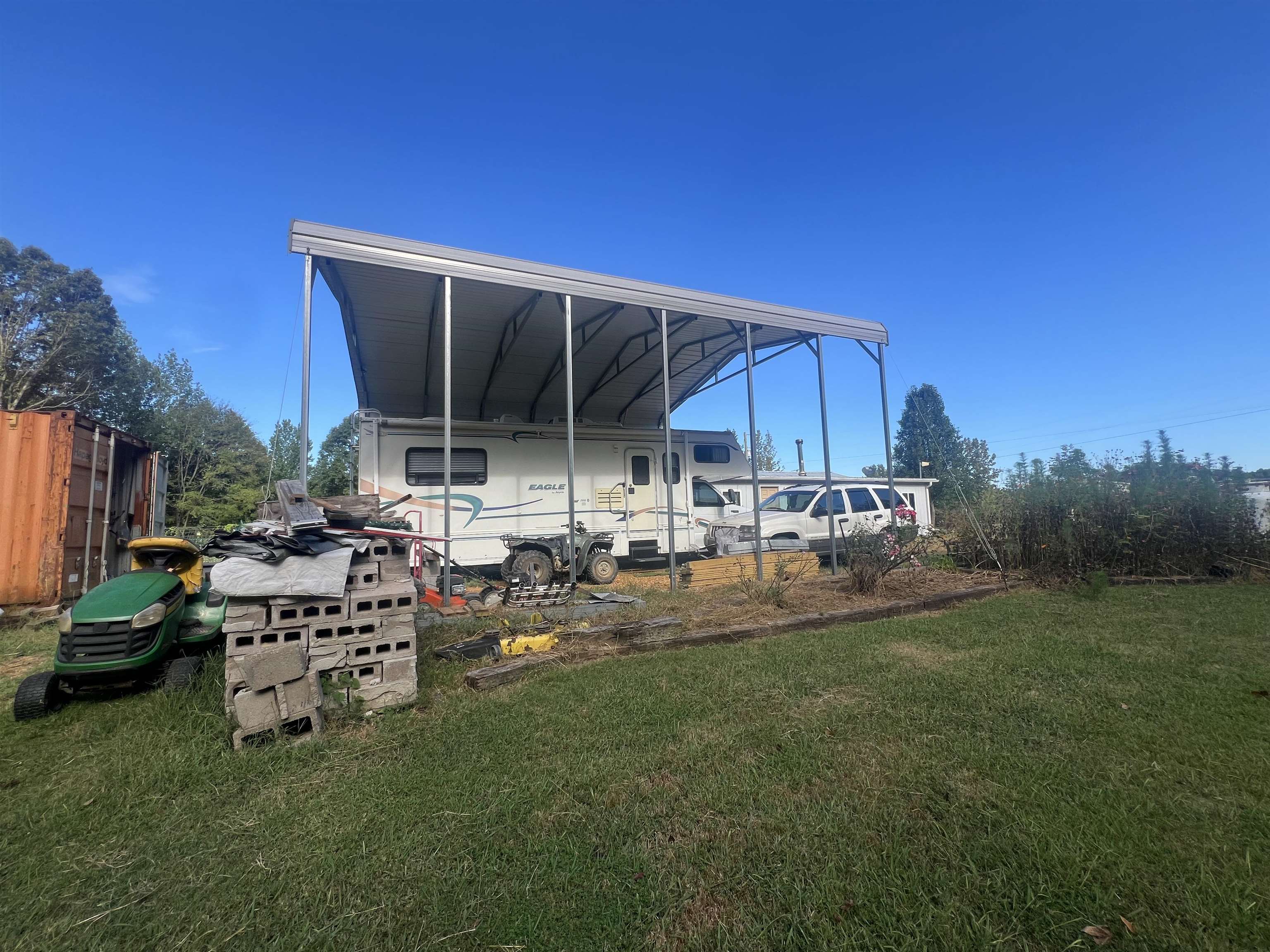 160 Finley Road Adamsville, TN 38310 - Photo 28 of 31 a view of backyard with seating area and green space