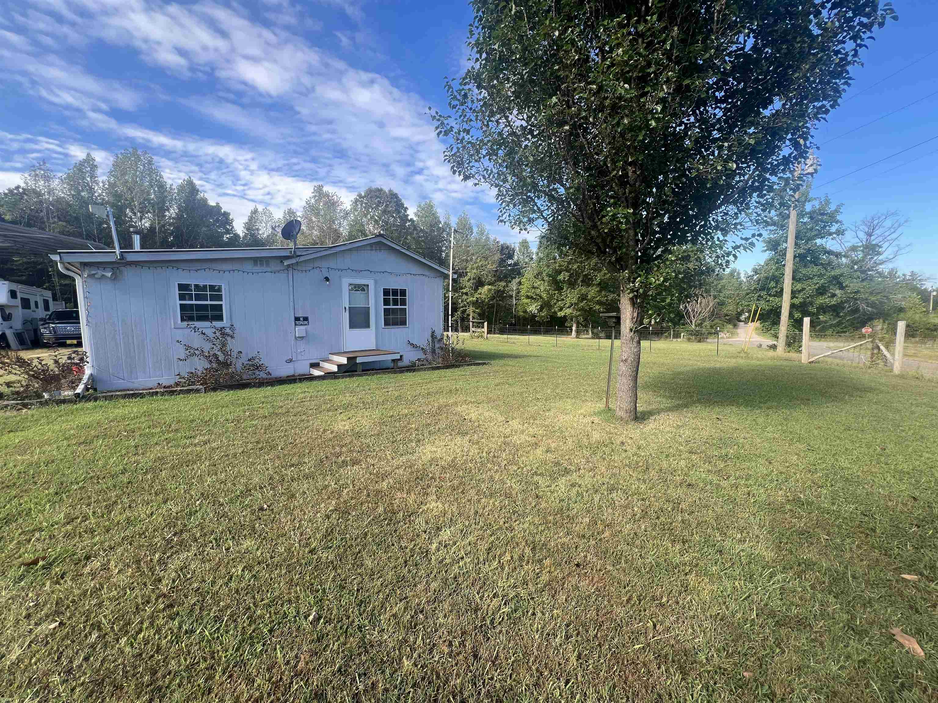 160 Finley Road Adamsville, TN 38310 - Photo 31 of 31 a view of a house with a yard and tree s