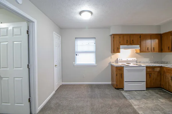 a kitchen with a stove and a sink