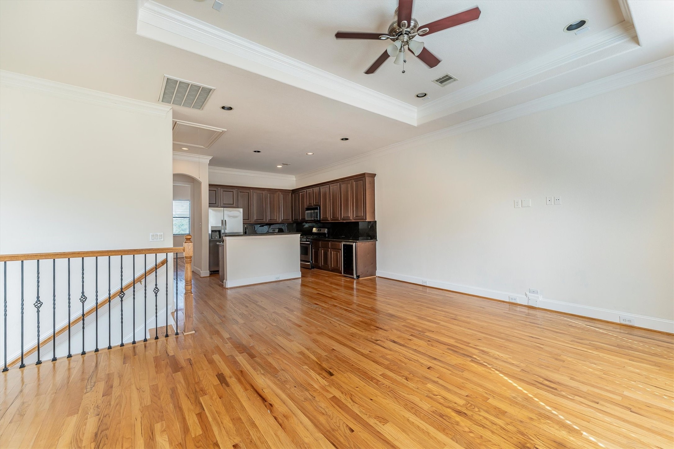 308 Grove Street Houston, TX 77020 - Photo 10 of 28 a view of empty room with wooden floor and ceiling fan