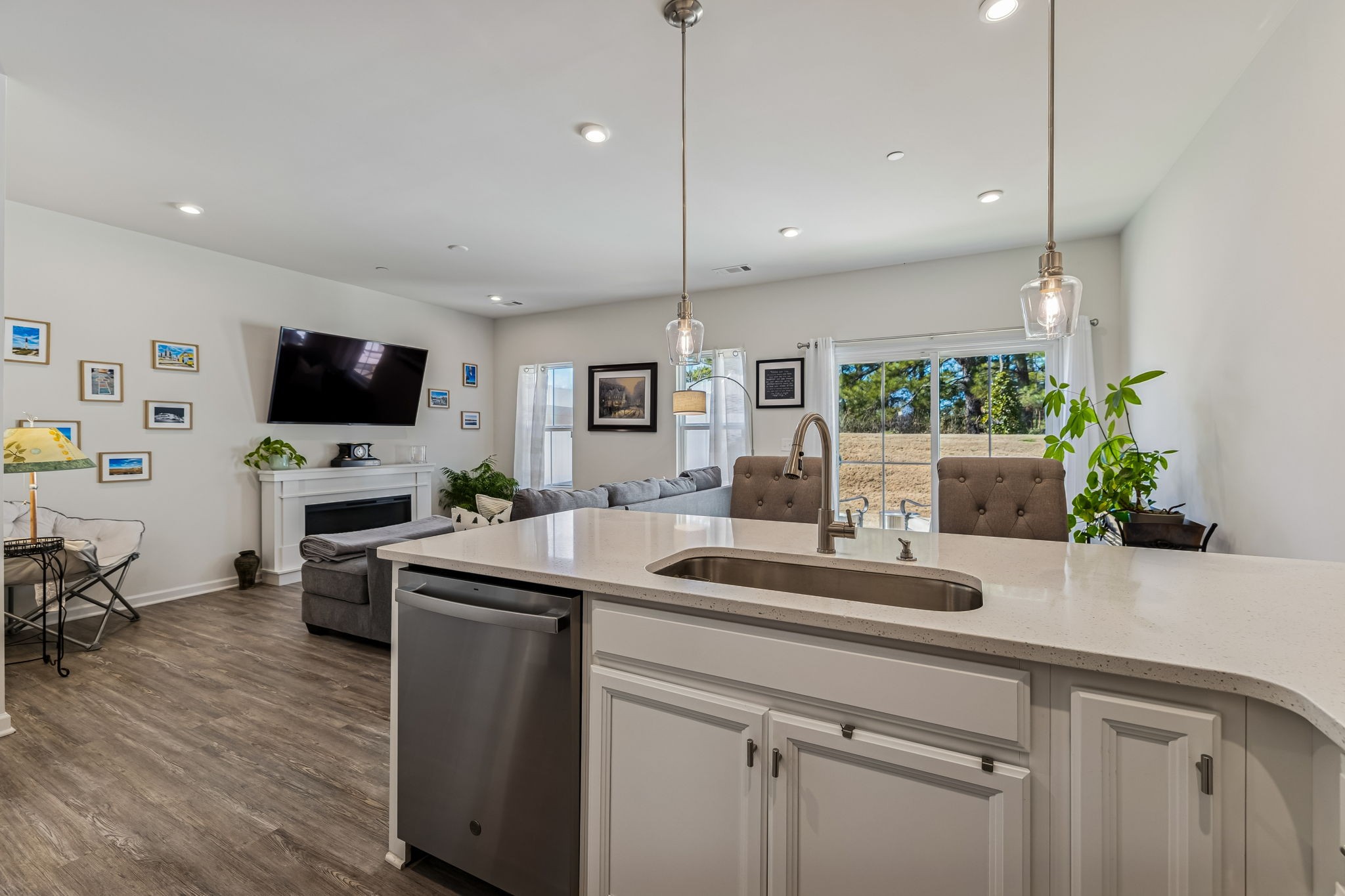 156 Keelon Gap Road Spring Hill, TN 37174 - Photo 19 of 39 a kitchen with kitchen island white cabinets and stainless steel appliances