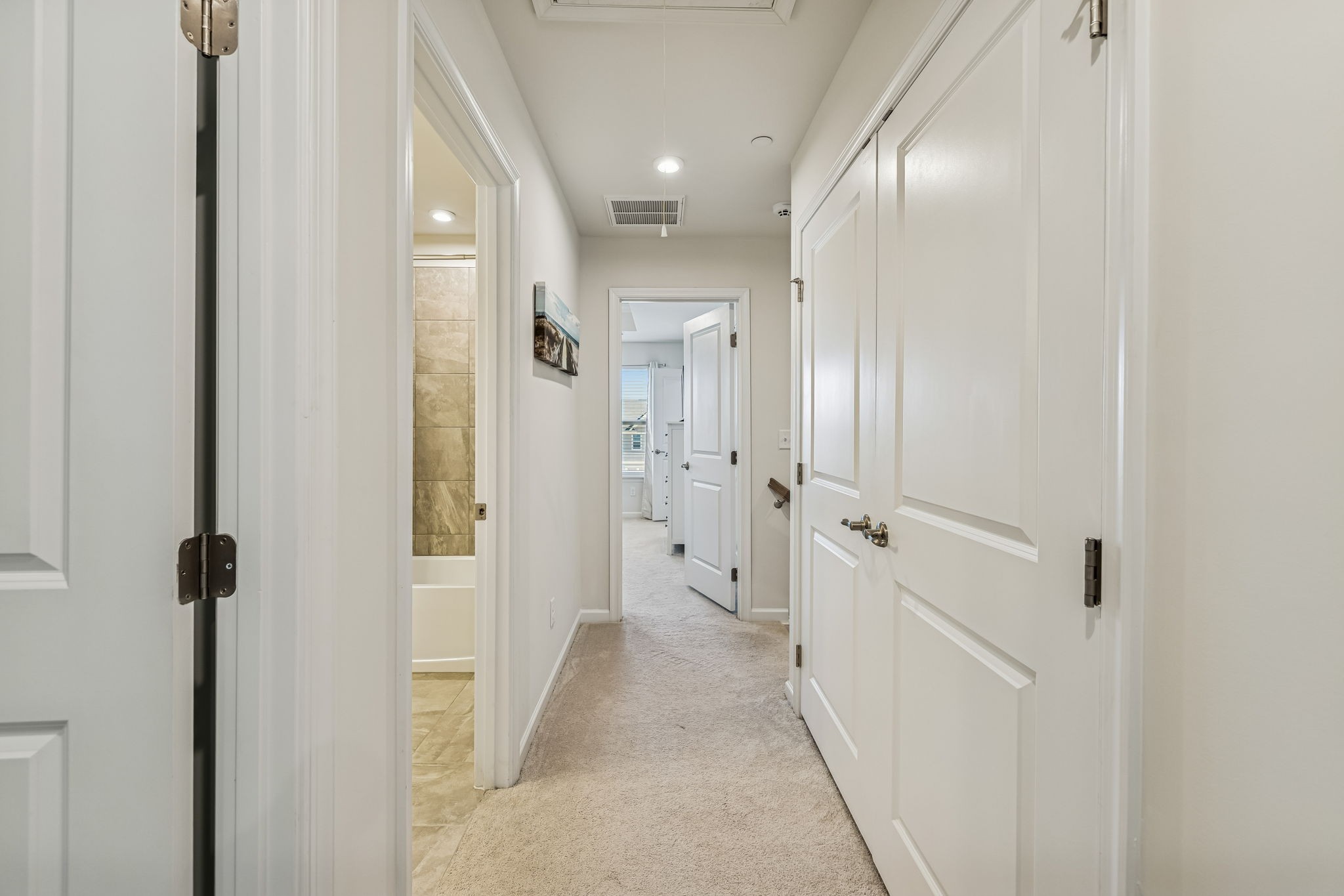 156 Keelon Gap Road Spring Hill, TN 37174 - Photo 23 of 39 a view of a hallway with wooden floor and a bathroom