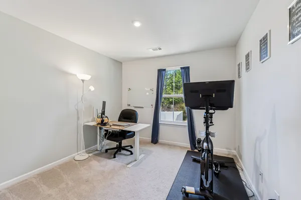 a view of a workspace with furniture