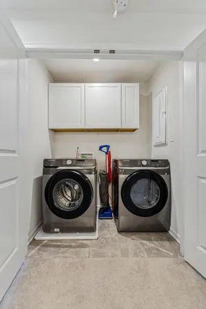 a utility room with sink washer and dryer