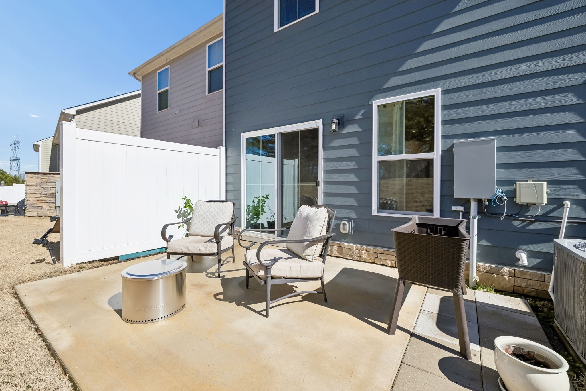 156 Keelon Gap Road Spring Hill, TN 37174 - Photo 34 of 39 a view of a patio with dining table and chairs and potted plants