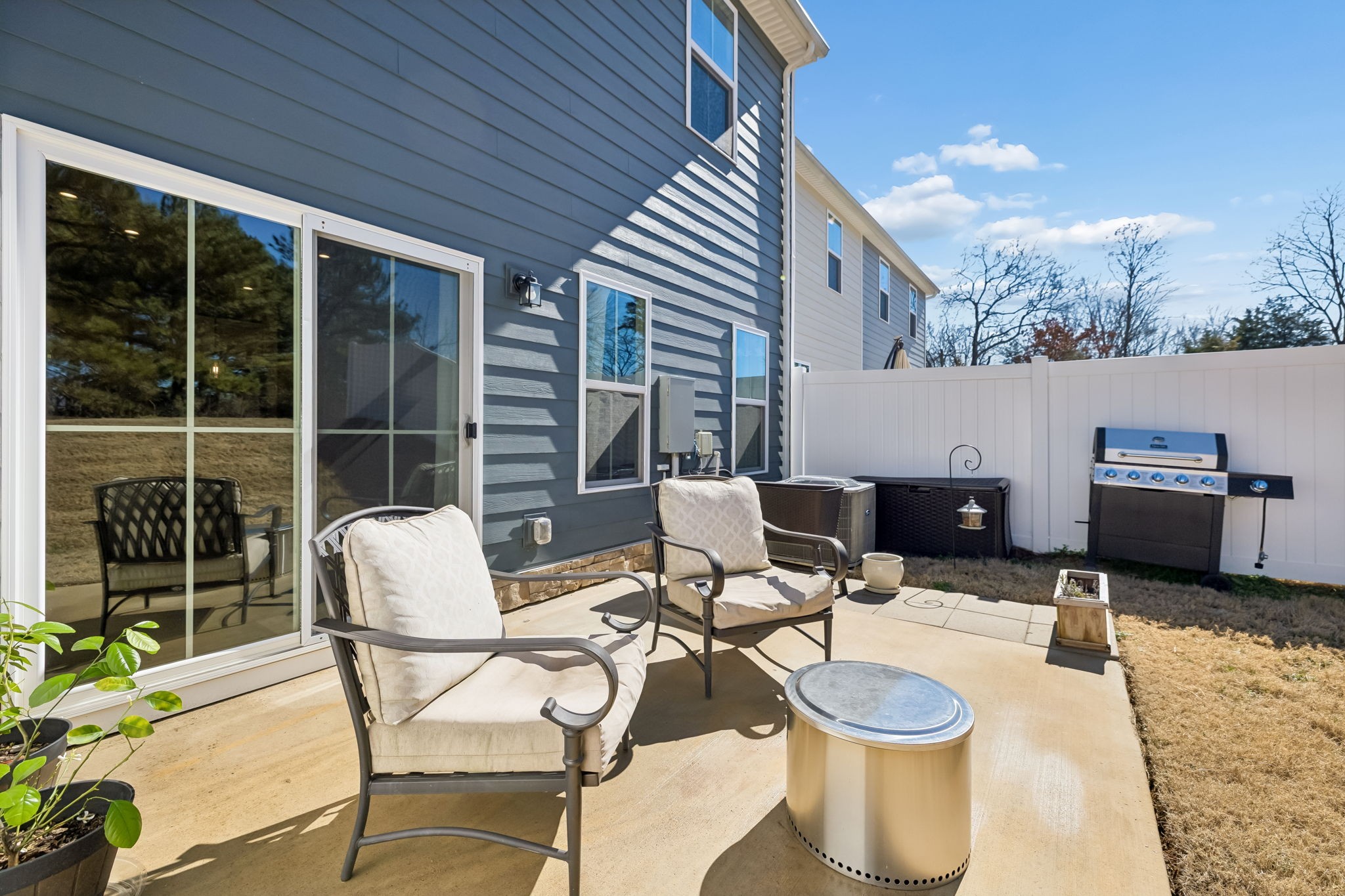 156 Keelon Gap Road Spring Hill, TN 37174 - Photo 35 of 39 a view of a patio with a dining table and chairs with wooden floor
