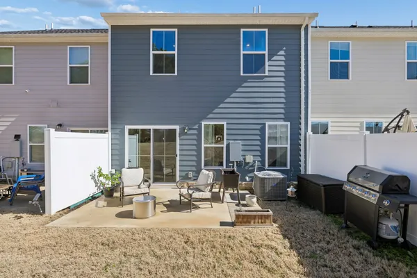 a view of a dinning table and chairs in the patio