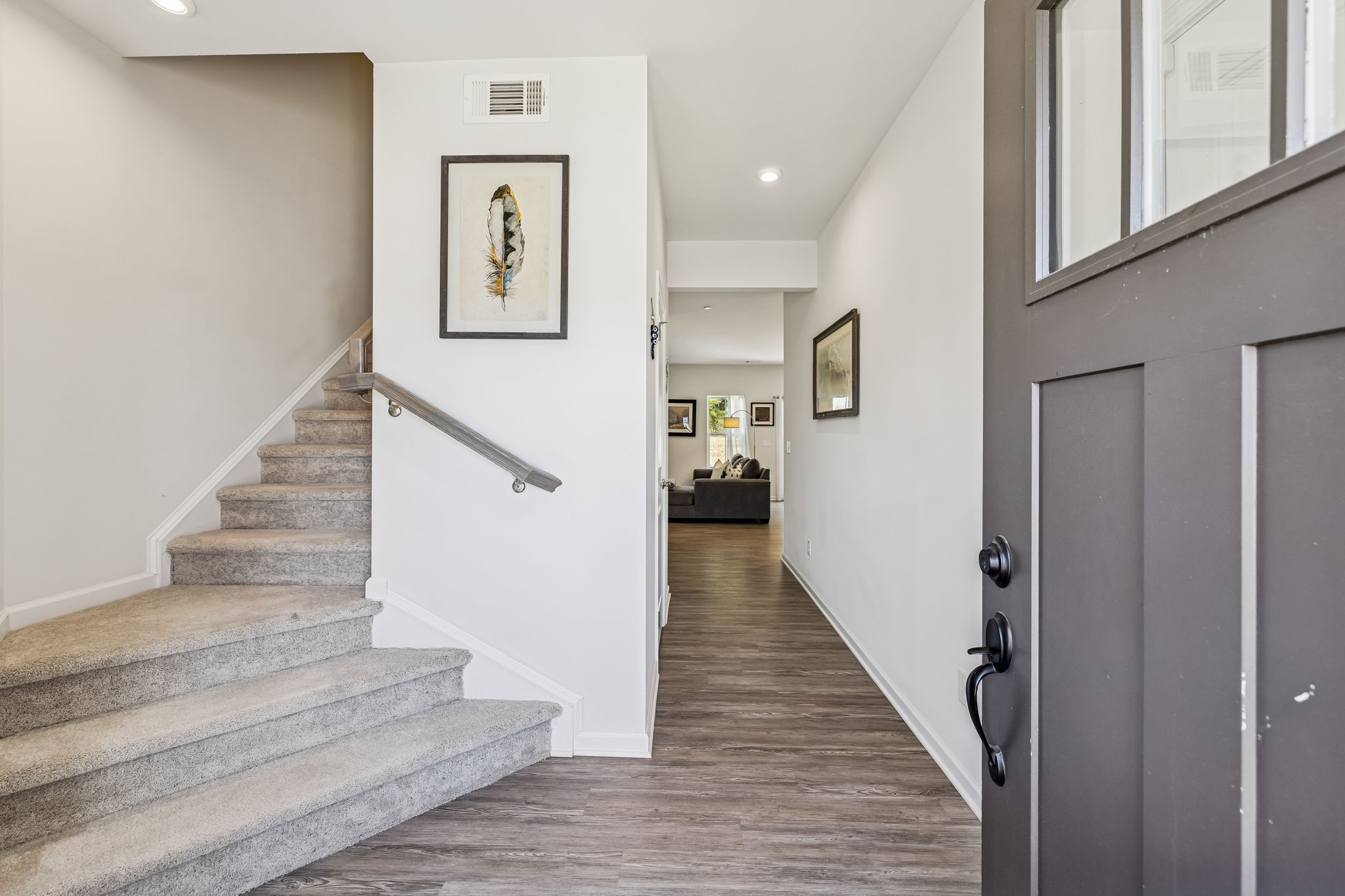 156 Keelon Gap Road Spring Hill, TN 37174 - Photo 4 of 39 a view of staircase with lots of frames and paintings on wall