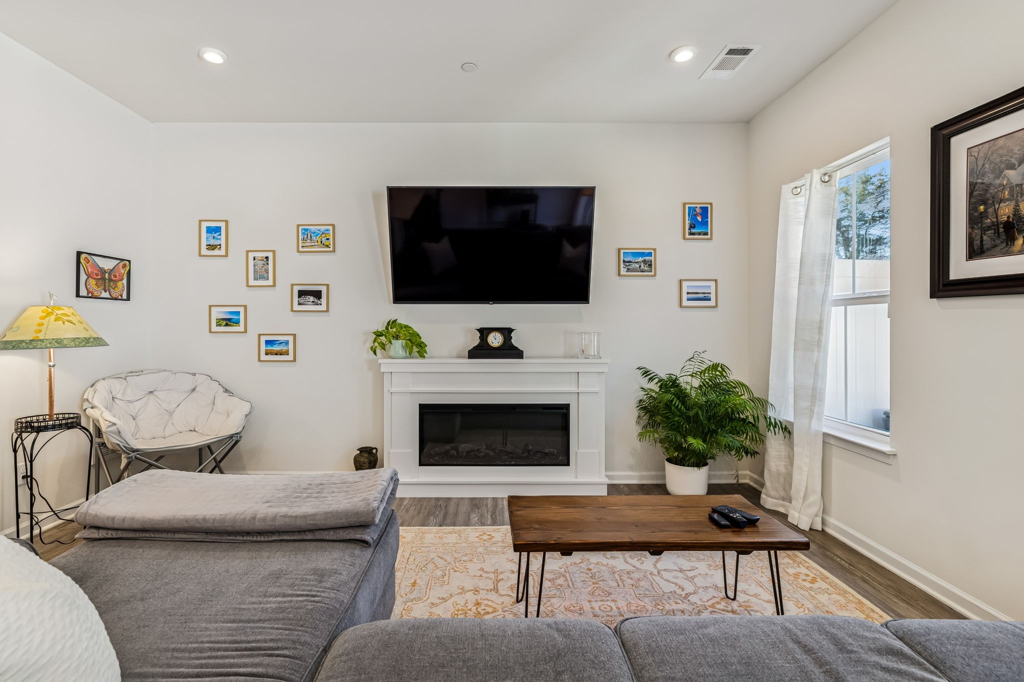 156 Keelon Gap Road Spring Hill, TN 37174 - Photo 9 of 39 a living room with furniture and a flat screen tv