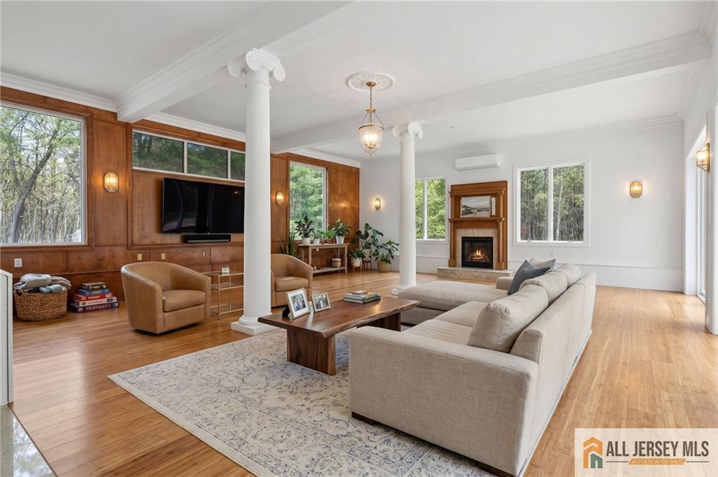 381 Monmouth Road Freehold, NJ 07728 - Photo 54 of 63 a living room with furniture and a flat screen tv
