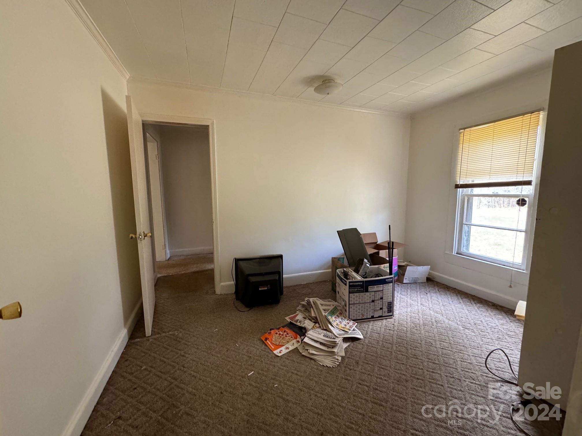 174 Lavender Road Ellenboro, NC 28040 - Photo 14 of 20 a view of a workspace with furniture and a window