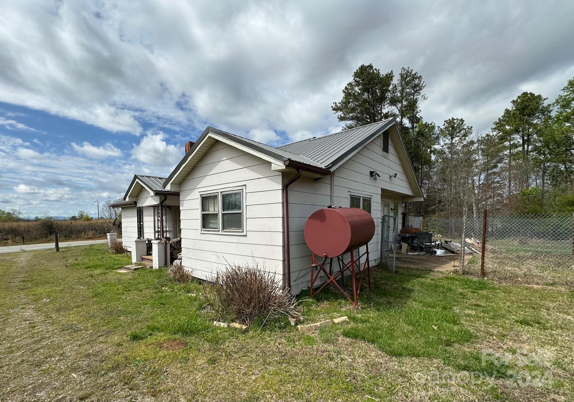 174 Lavender Road Ellenboro, NC 28040 - Photo 5 of 20 a backyard of a house with table and chairs