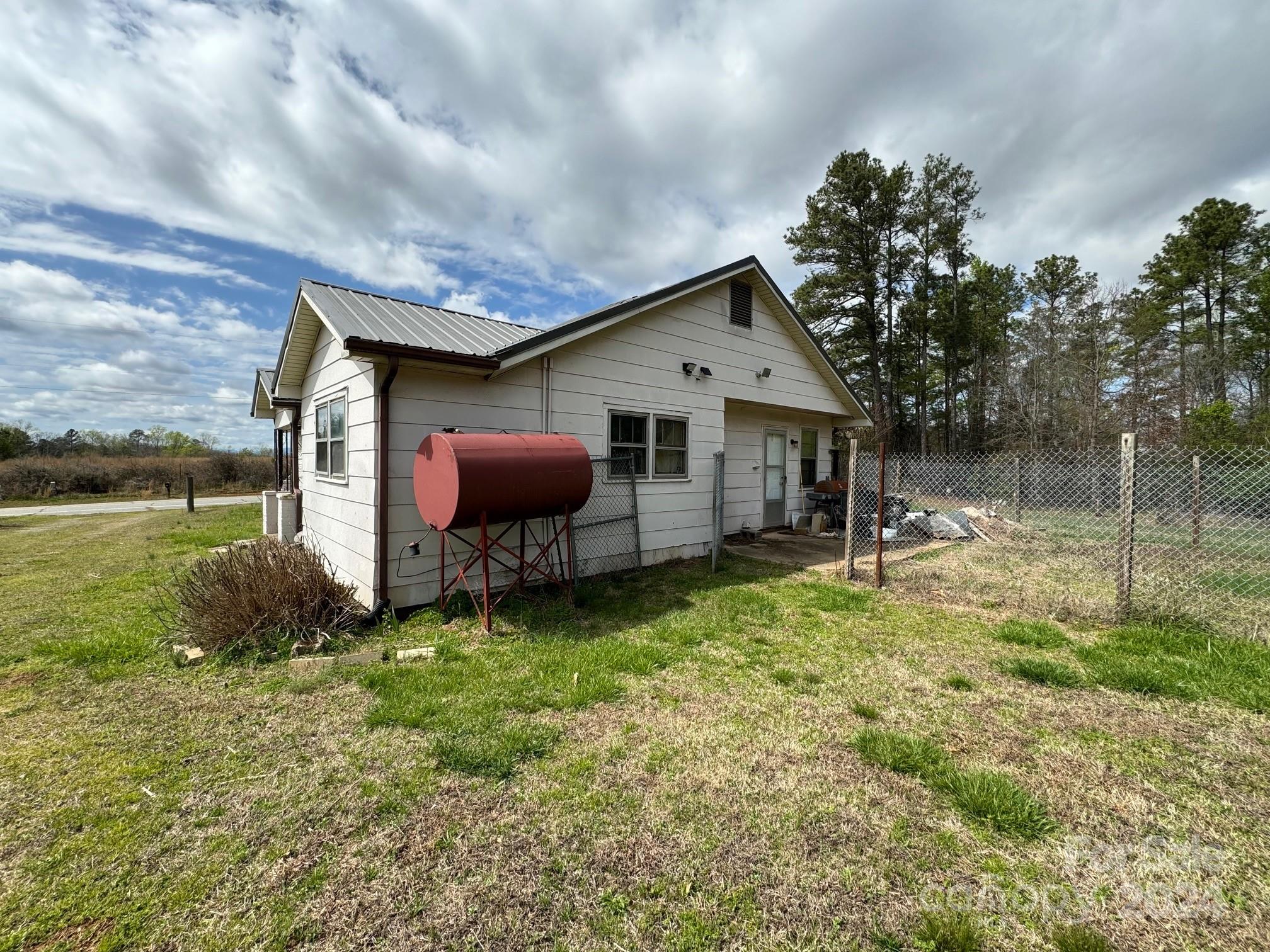174 Lavender Road Ellenboro, NC 28040 - Photo 6 of 20 a backyard of a house with table and chairs