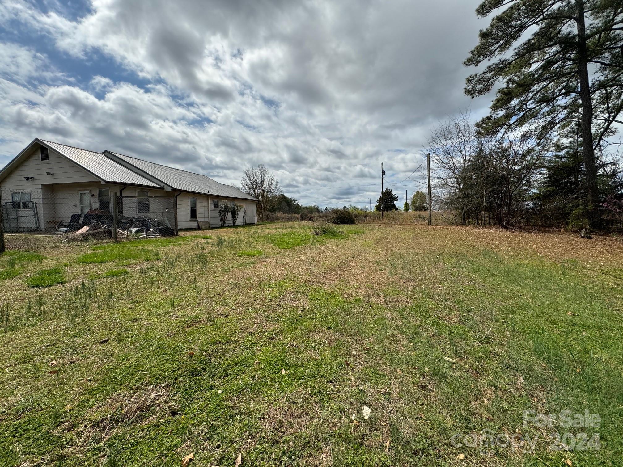 174 Lavender Road Ellenboro, NC 28040 - Photo 8 of 20 a view of a house with a yard and sitting area