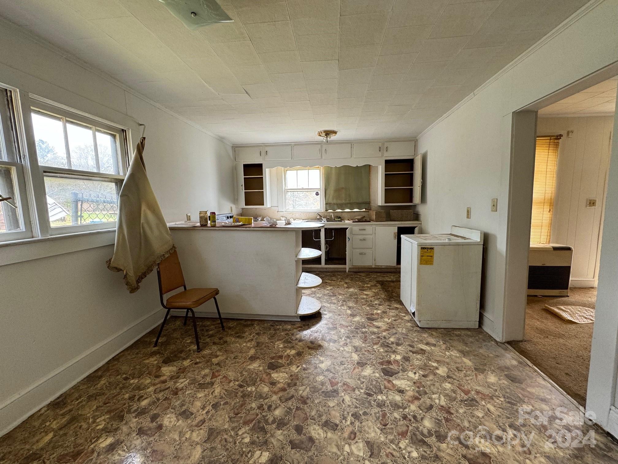 174 Lavender Road Ellenboro, NC 28040 - Photo 10 of 20 a living room with a large window and chairs