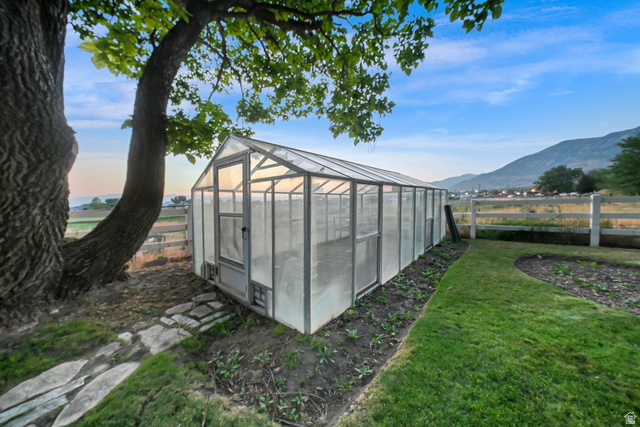 374 West Lakeview Road Lindon, UT 84042 - Photo 7 of 44 Freestanding greenhouse with a metal frame and translucent panels