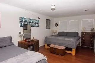 a bedroom with a bed and a table in it