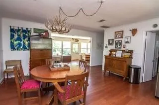 a dining room with furniture and window