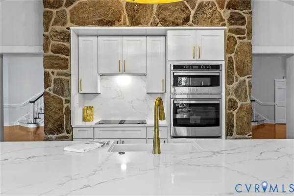 a kitchen with stainless steel appliances a stove and a refrigerator