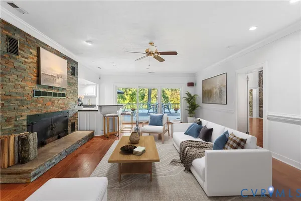 a living room with furniture fireplace and flat screen tv