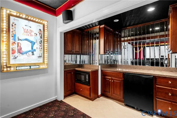 a living room with fireplace furniture and a flat screen tv