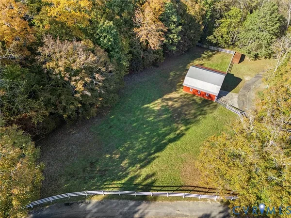a view of a pathway with a wrought fence