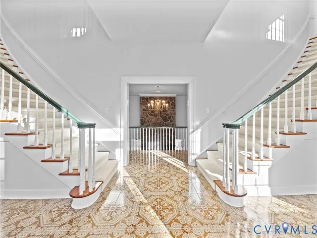 a room with lots of white walls and glass windows