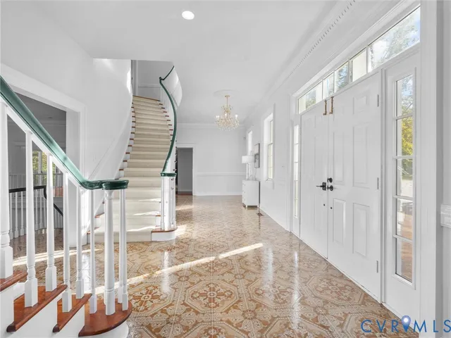 a view of entryway with furniture and wooden floor