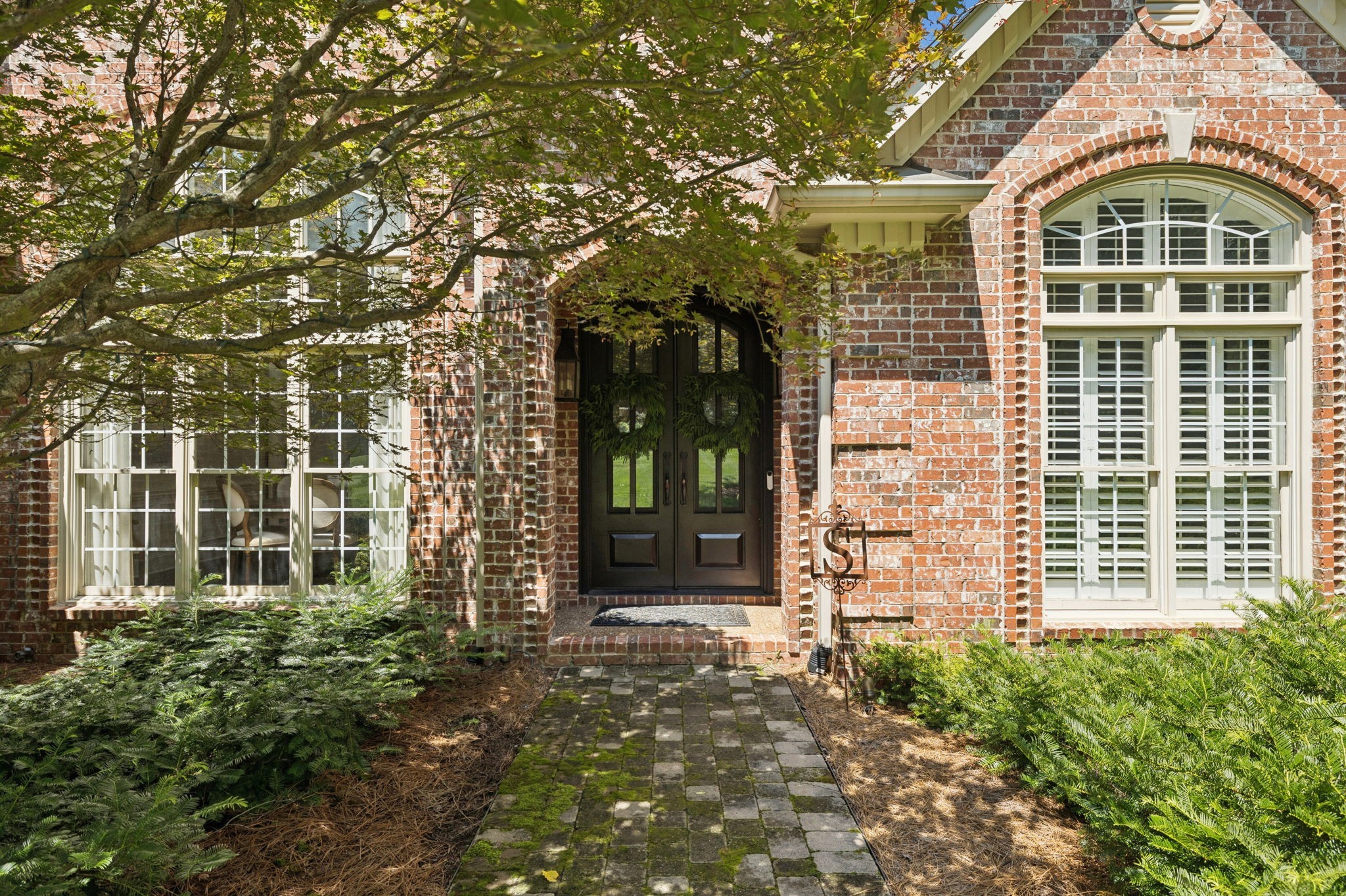 829 Highgrove Circle Franklin, TN 37069 - Photo 2 of 98 front view of a brick house with a door