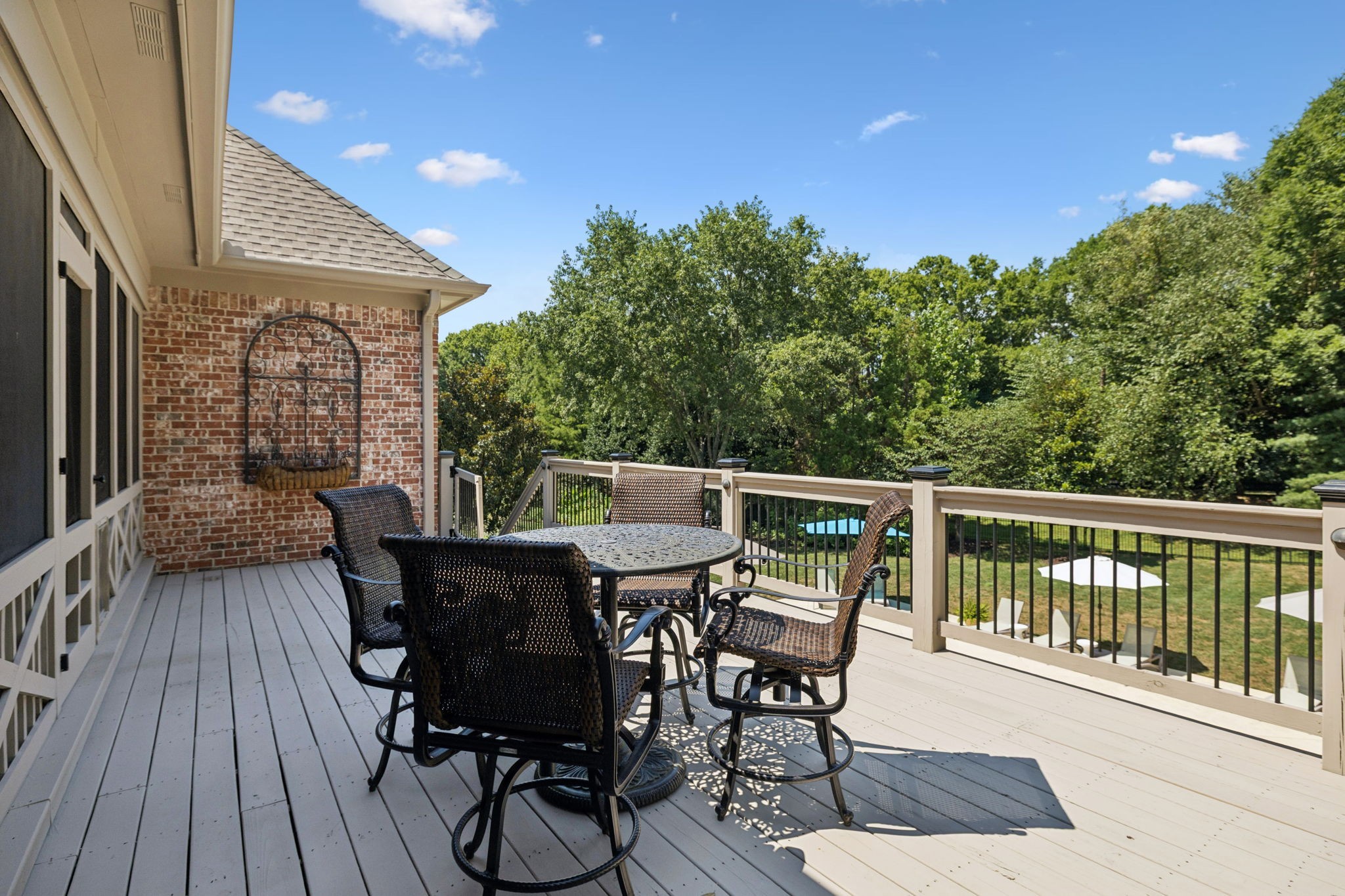 829 Highgrove Circle Franklin, TN 37069 - Photo 41 of 98 a view of a deck with table and chairs with wooden floor and fence