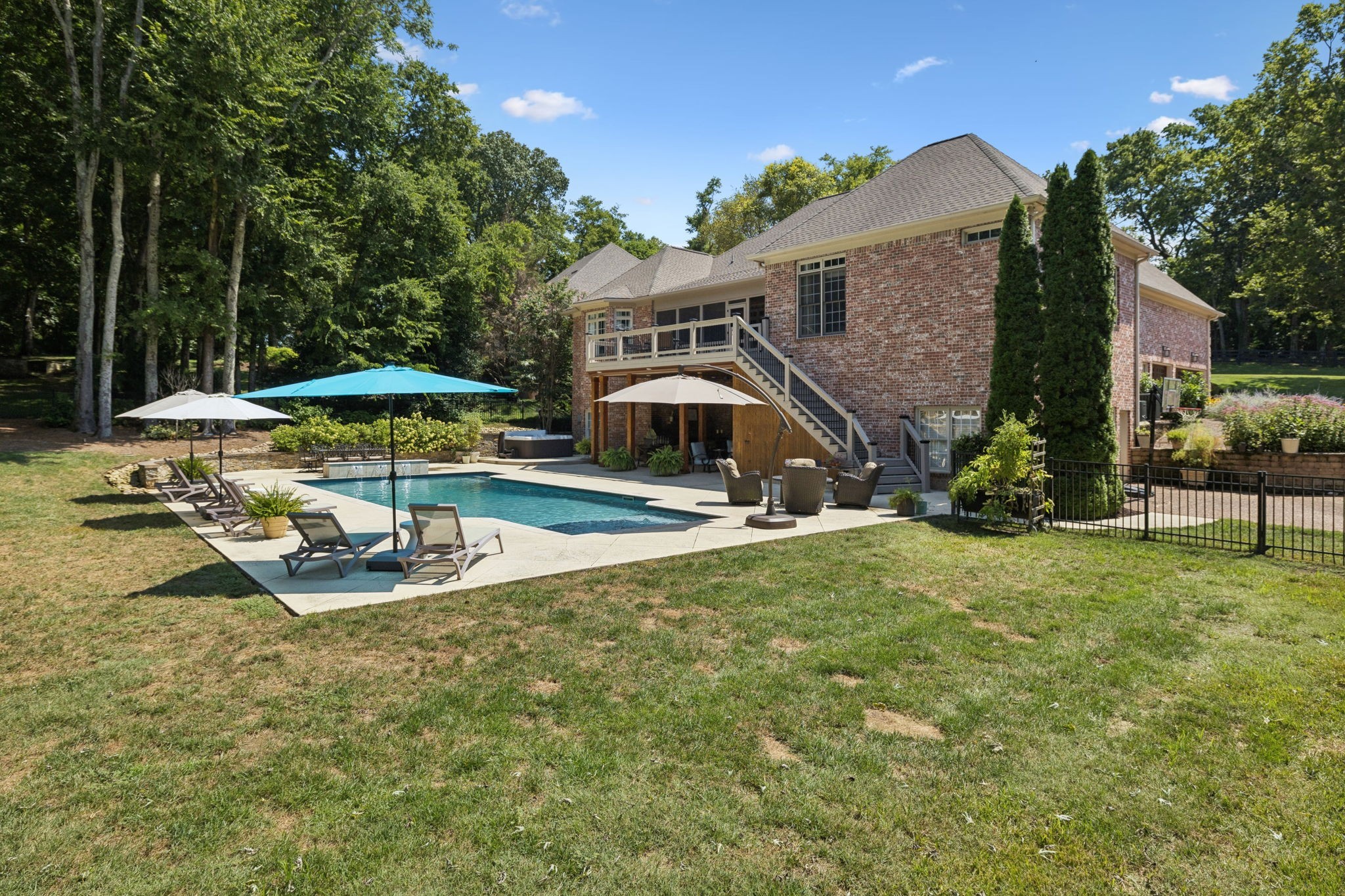829 Highgrove Circle Franklin, TN 37069 - Photo 79 of 98 a view of a house with backyard patio and swimming pool