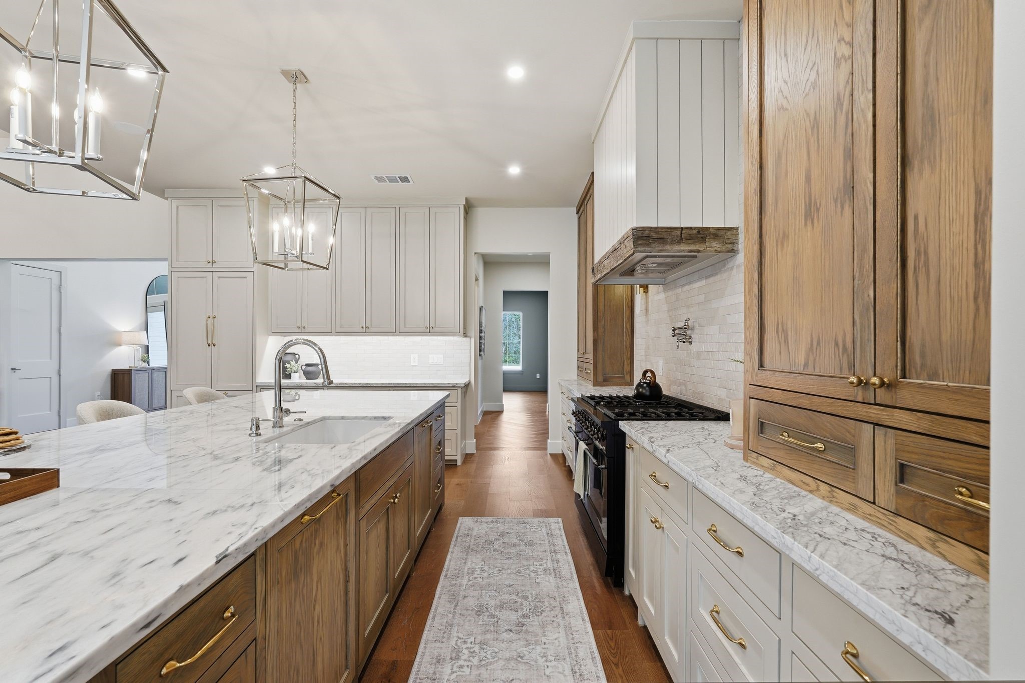 7248 Red Oak Grove Road Montgomery, TX 77316 - Photo 13 of 50 a large kitchen with granite countertop a large counter top a sink stainless steel appliances and cabinets