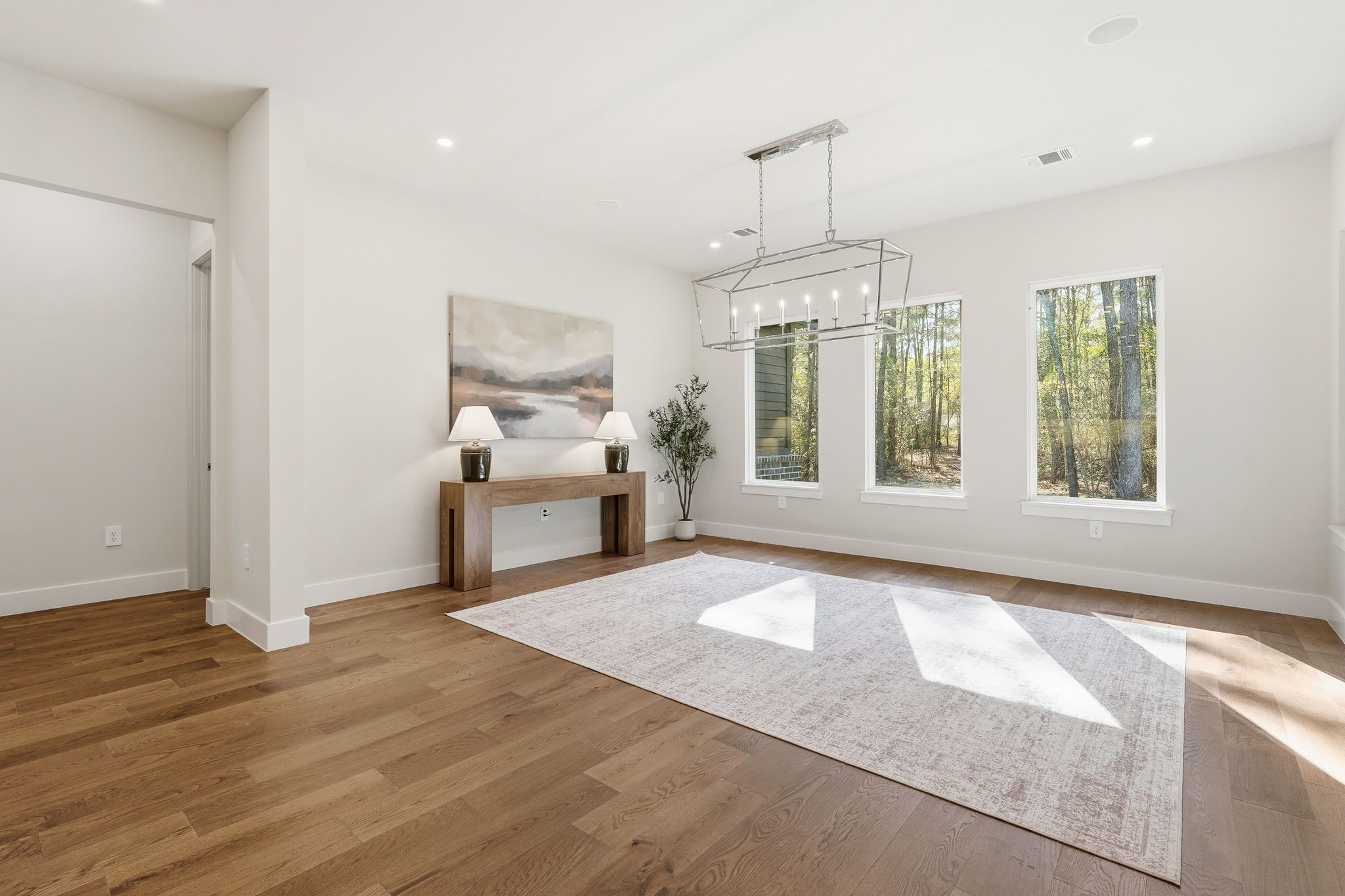7248 Red Oak Grove Road Montgomery, TX 77316 - Photo 14 of 50 a view of an empty room with window and hardwood floor