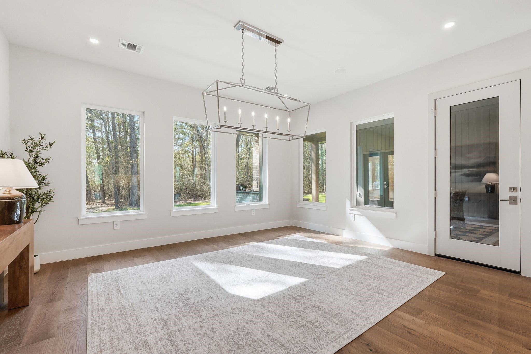 7248 Red Oak Grove Road Montgomery, TX 77316 - Photo 15 of 50 a view of an empty room with a window and wooden floor