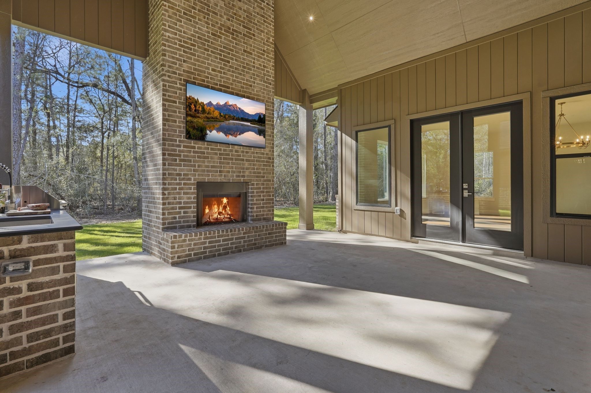7248 Red Oak Grove Road Montgomery, TX 77316 - Photo 44 of 50 a living room with a fireplace and a large window