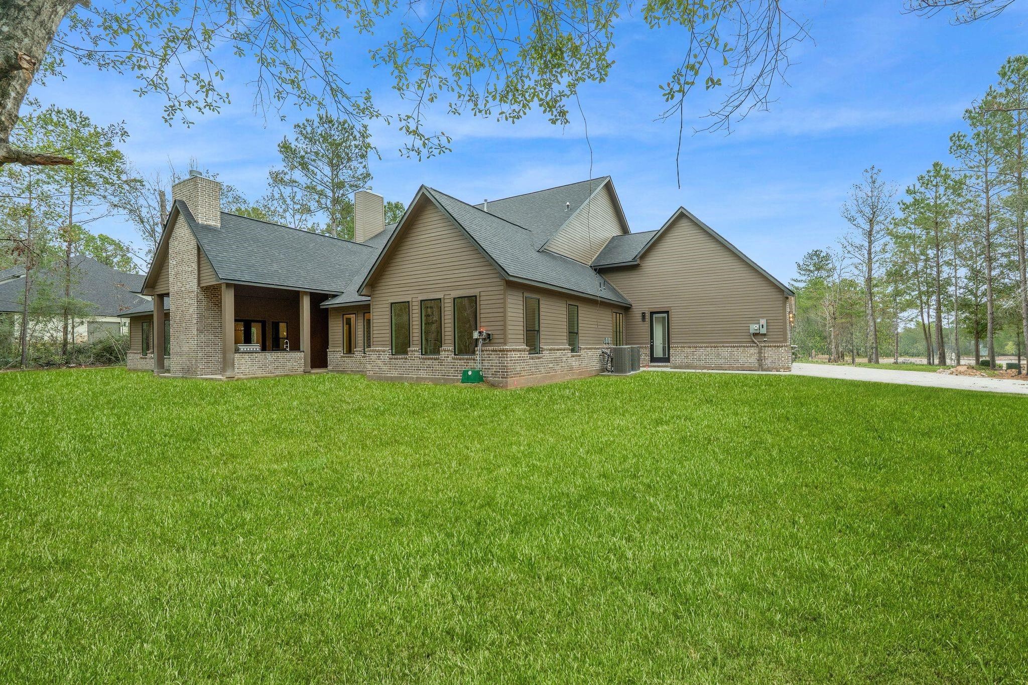 7248 Red Oak Grove Road Montgomery, TX 77316 - Photo 46 of 50 a view of a house with a yard