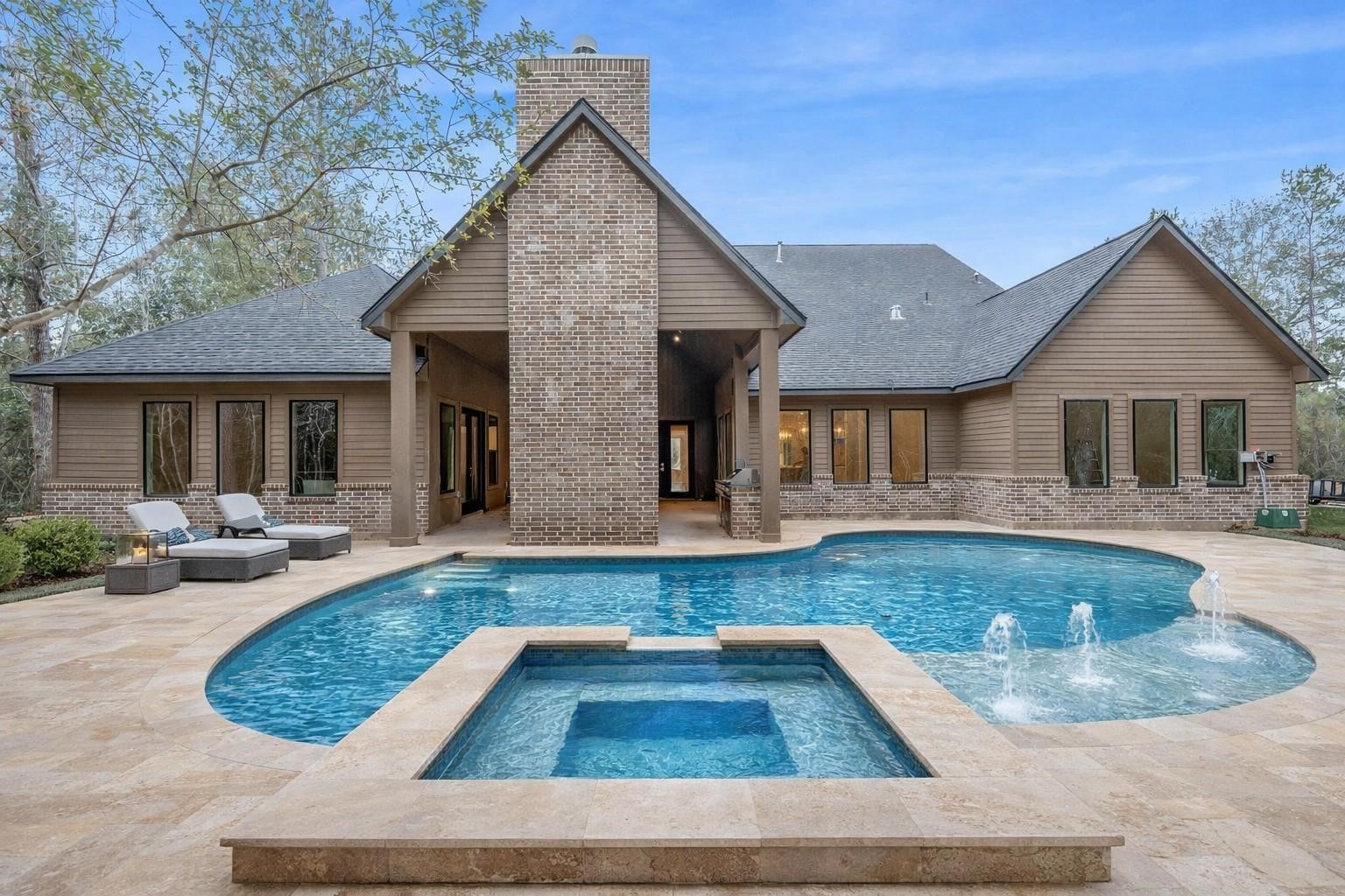 7248 Red Oak Grove Road Montgomery, TX 77316 - Photo 48 of 50 a view of a house with swimming pool and sitting area
