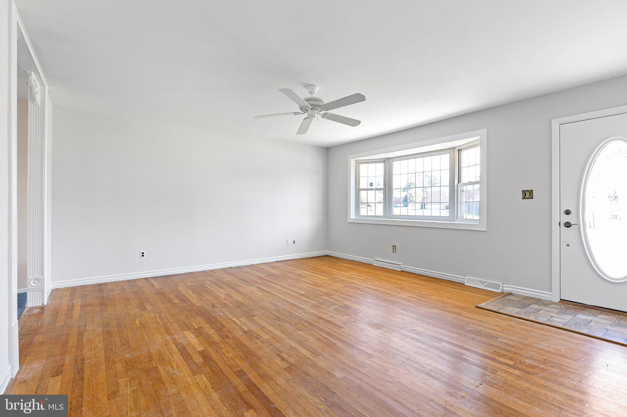 8 Trevett Boulevard Newark, DE 19702 - Photo 8 of 23 wooden floor in an empty room with a window