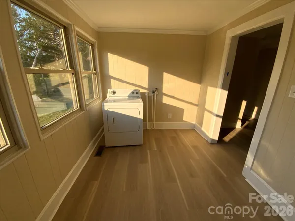 a view of an entryway with wooden floor