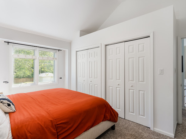 918 Meadow Road Northbrook, IL 60062 - Photo 30 of 38 a bed sitting in a spacious bedroom next to a window
