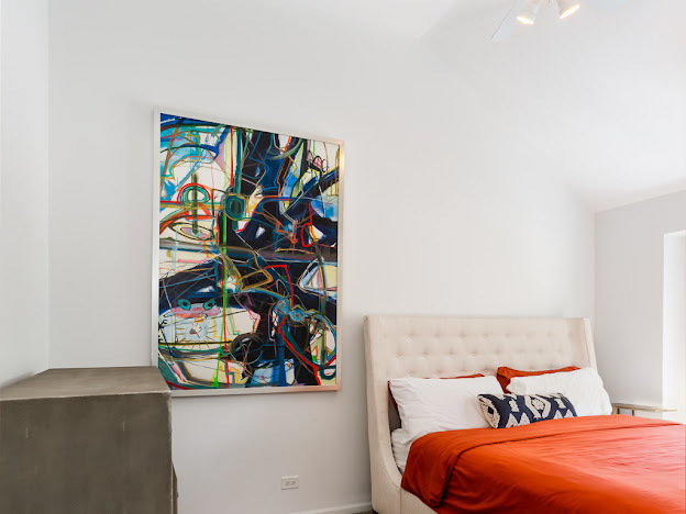 918 Meadow Road Northbrook, IL 60062 - Photo 32 of 38 view of a bedroom with a bed and a painting on the wall