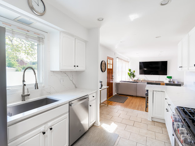 918 Meadow Road Northbrook, IL 60062 - Photo 7 of 38 a view of a kitchen with kitchen island a sink stainless steel appliances and cabinets