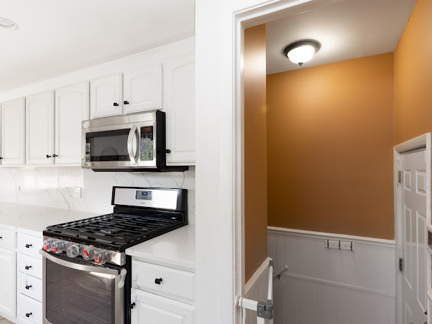 918 Meadow Road Northbrook, IL 60062 - Photo 9 of 38 a kitchen with a stove and a microwave