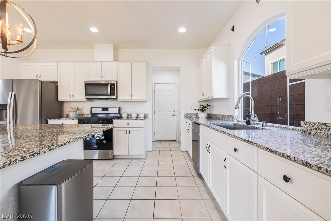 5510 Ripple Ridge Avenue Las Vegas, NV 89139 - Photo 23 of 45 Bright and open, this kitchen features sleek appliances, ample counter space, and abundant natural light.